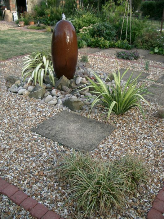 Water feature on a gravel & pebble terrace